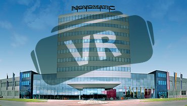 Gebäude Außenansicht des NOVOMATIC Headquarters in Gumpoldskirchen mit grauem VR Schriftzug über dem Gebäude
